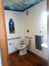 Remodeled bathroom with ceiling mural by Adam Richards